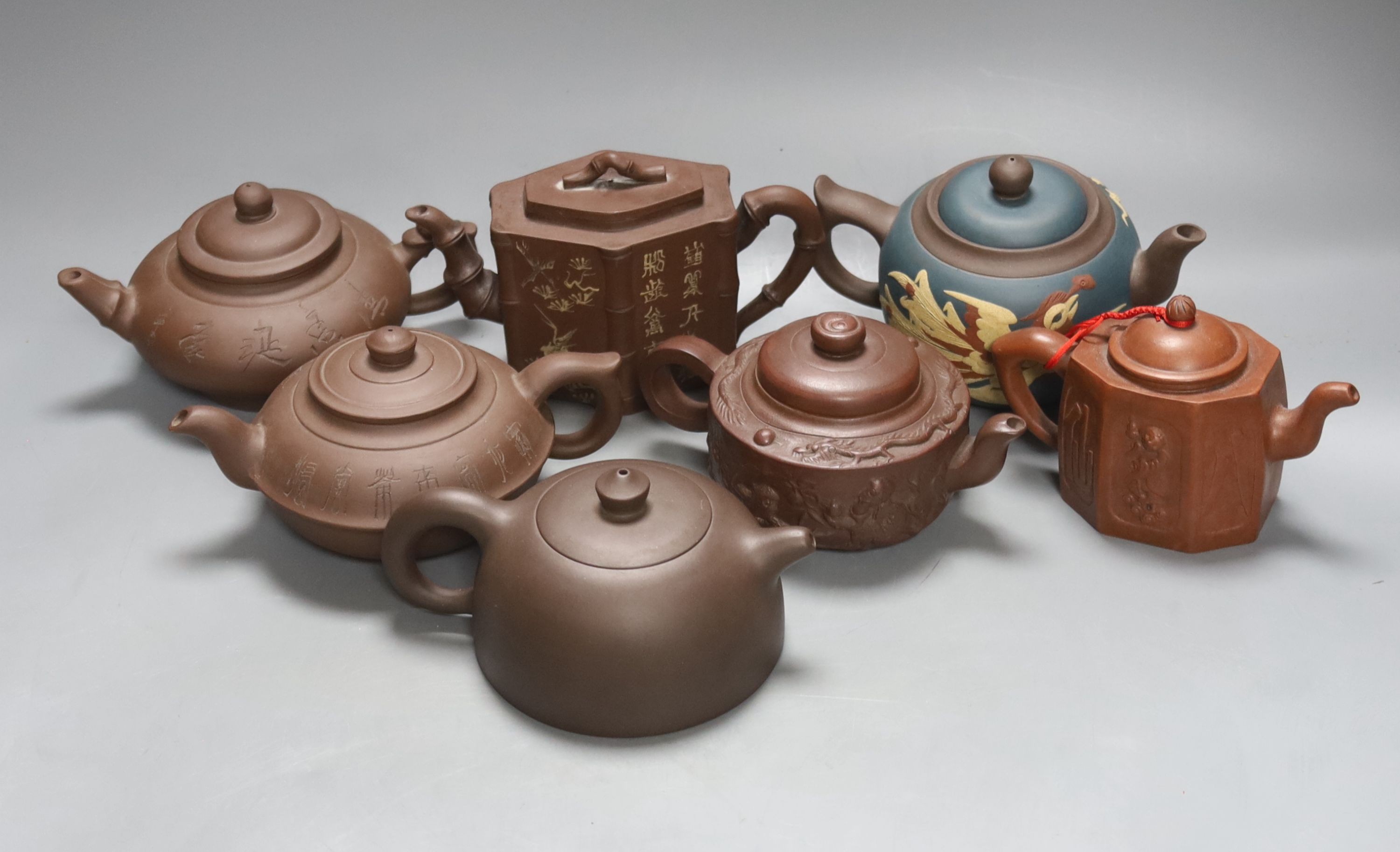 Seven Chinese Yixing teapots, tallest 11 cms high.